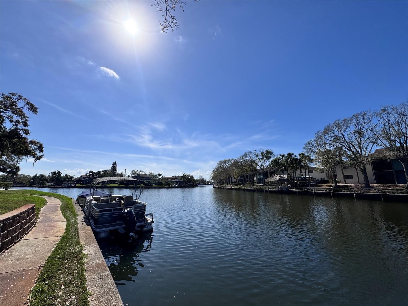 Enjoy access to a boat ramp, boat lift, boat parking, tennis courts, a scenic waterfront walking path, four pools, and an adult-only clubhouse with a pool table providing endless entertainment.