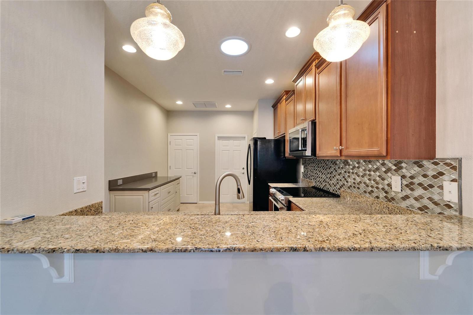 Looking into the kitchen from the dining area.