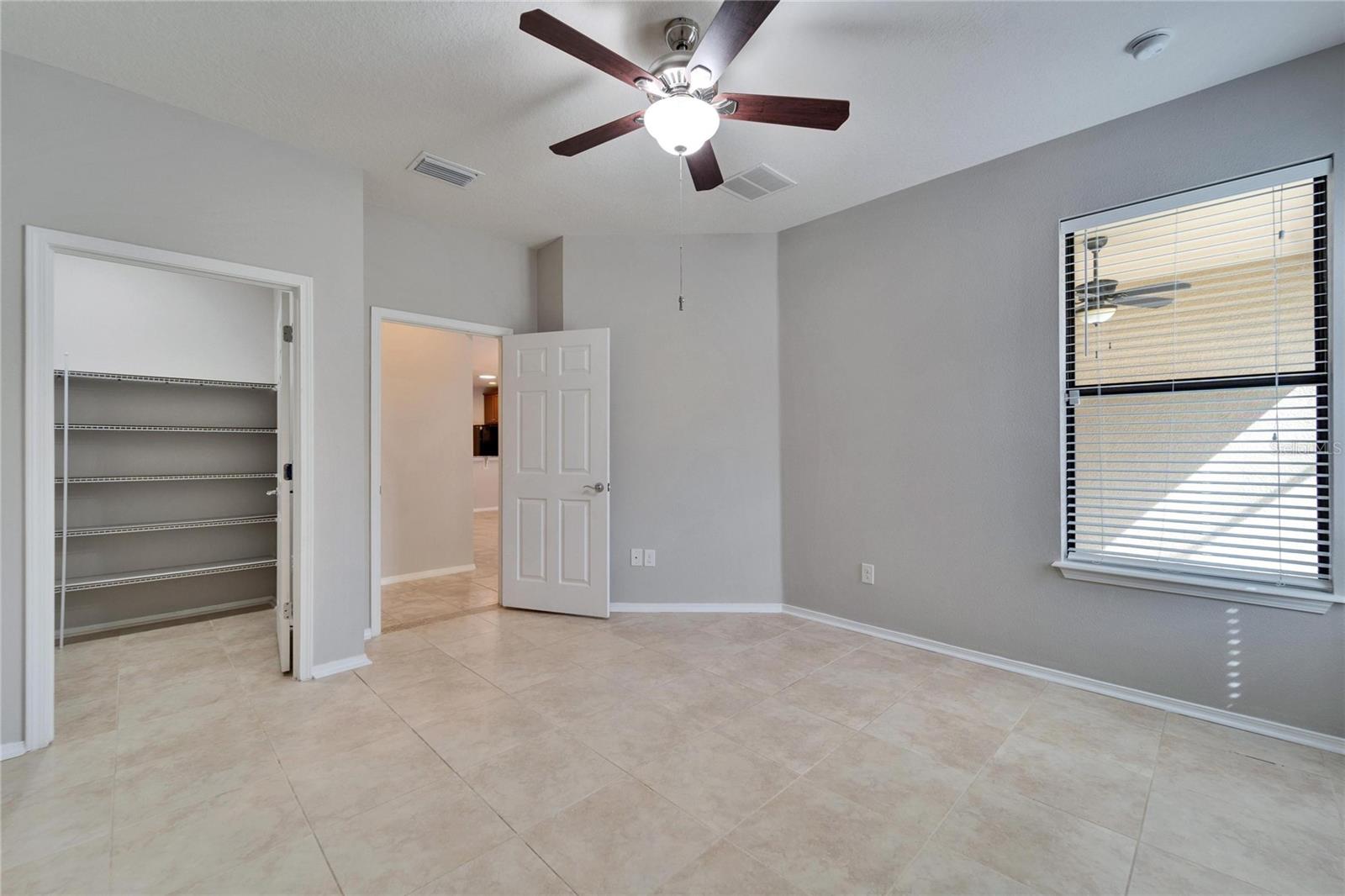 Entrance to owner's suite with walkin closet on the left.