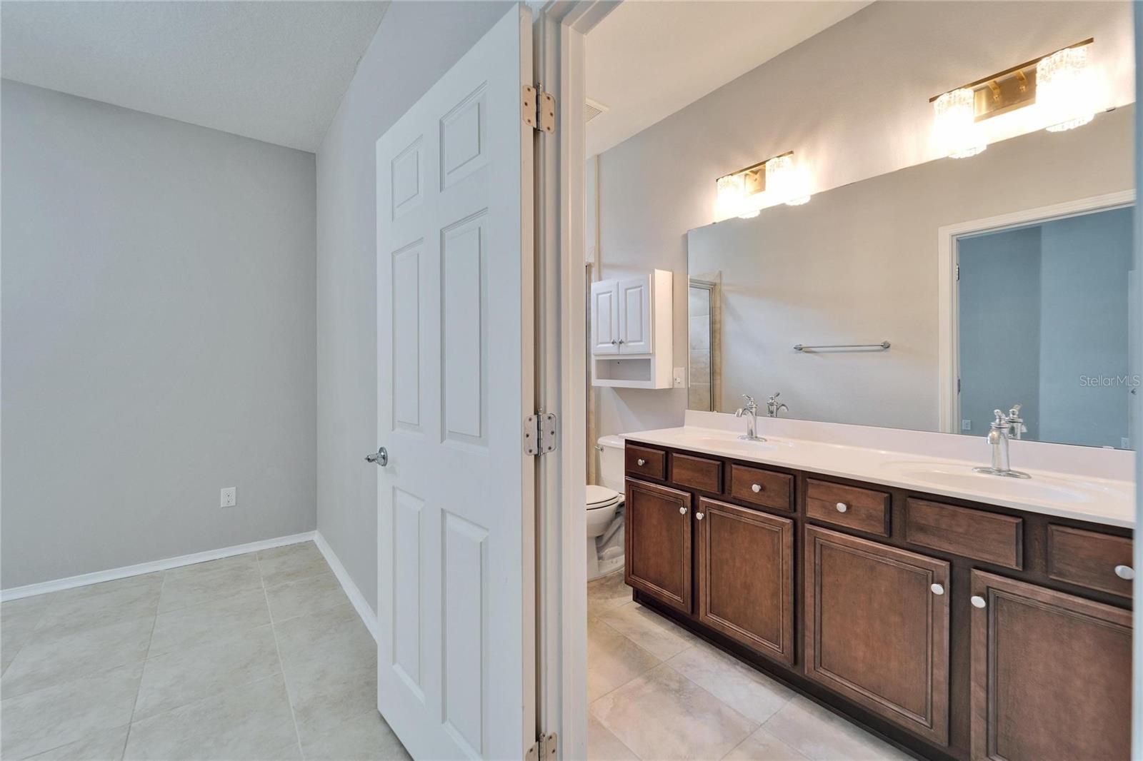 Entrance to owner's suite bathroom with double sinks.