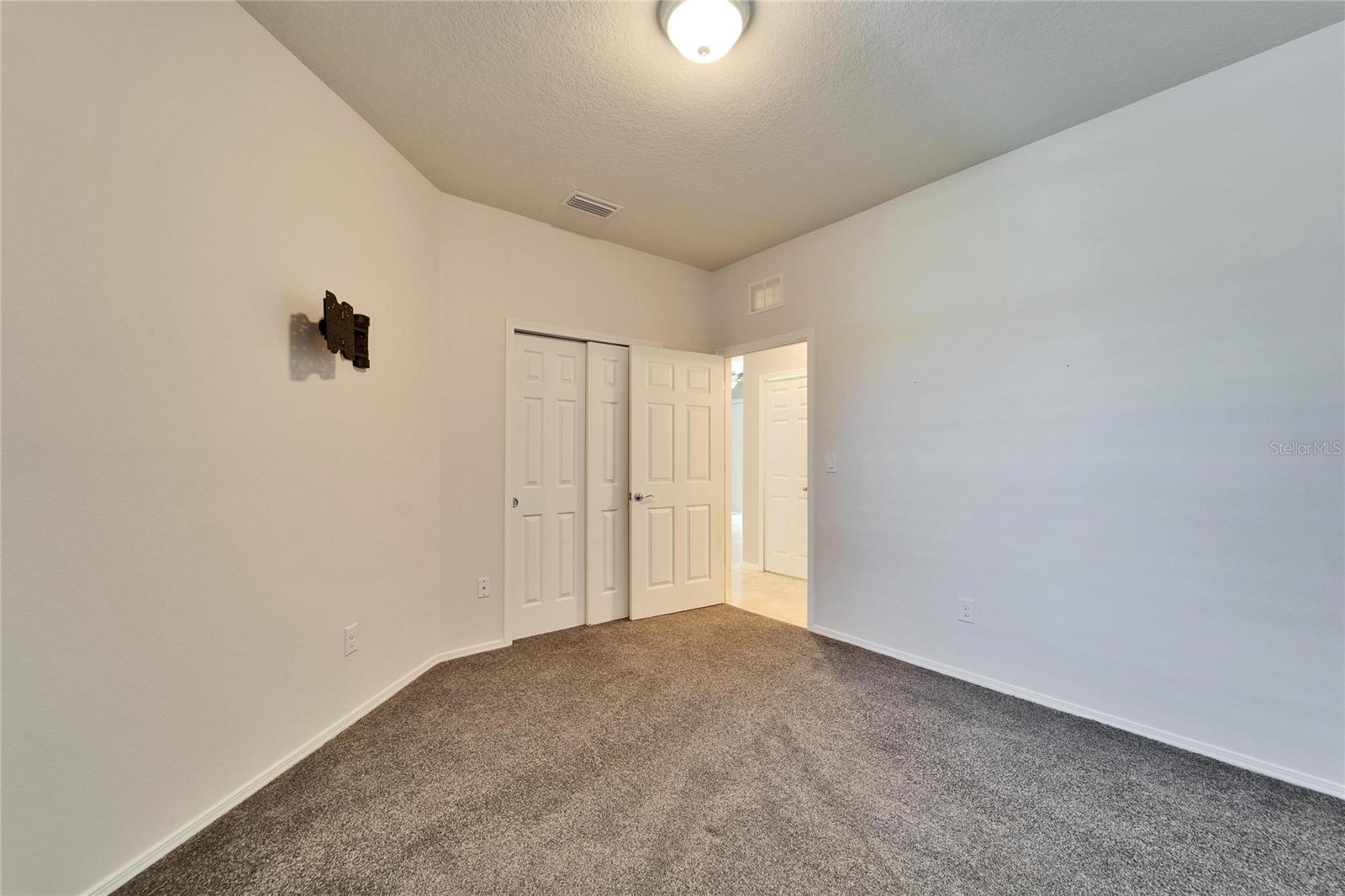 Door to hallway from guest bedroom.