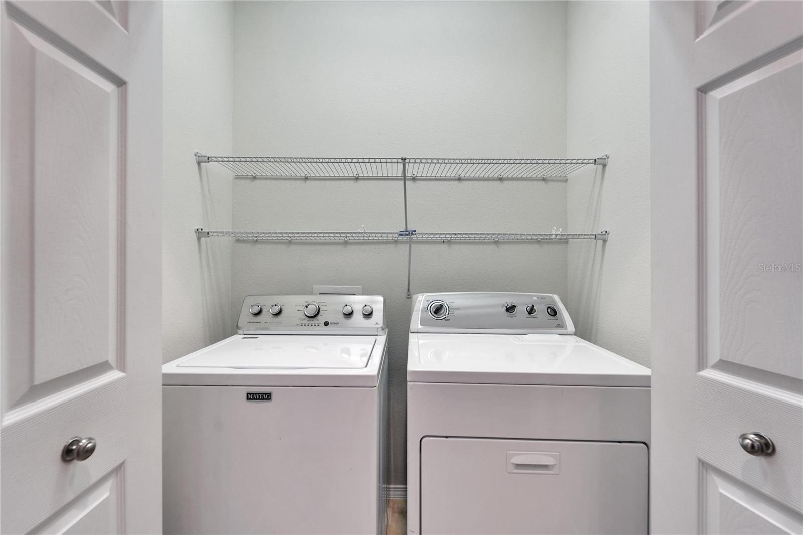 Washer and dryer in laundry closet.