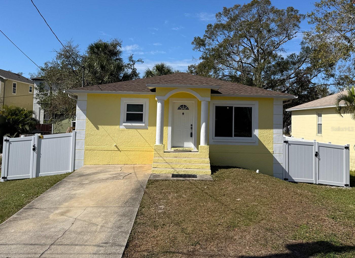 Elevated home with brand new windows and sliders.