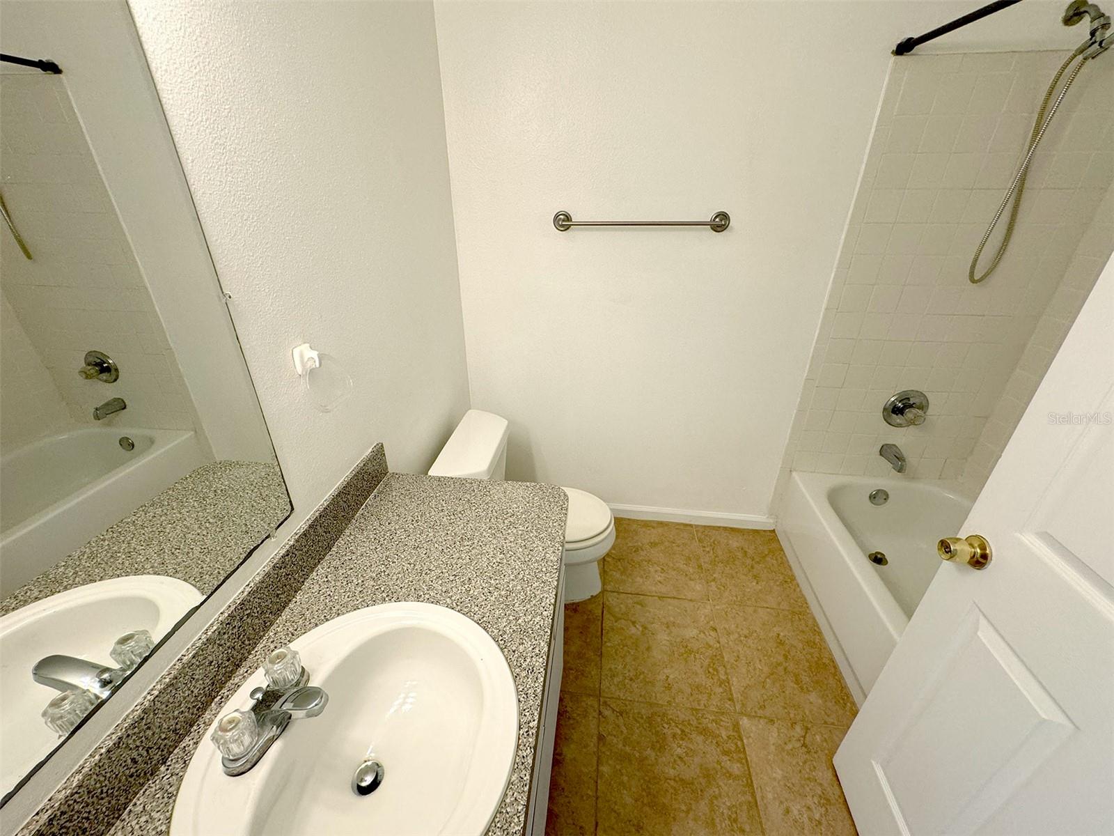 Hall bath with shower/tub combo.