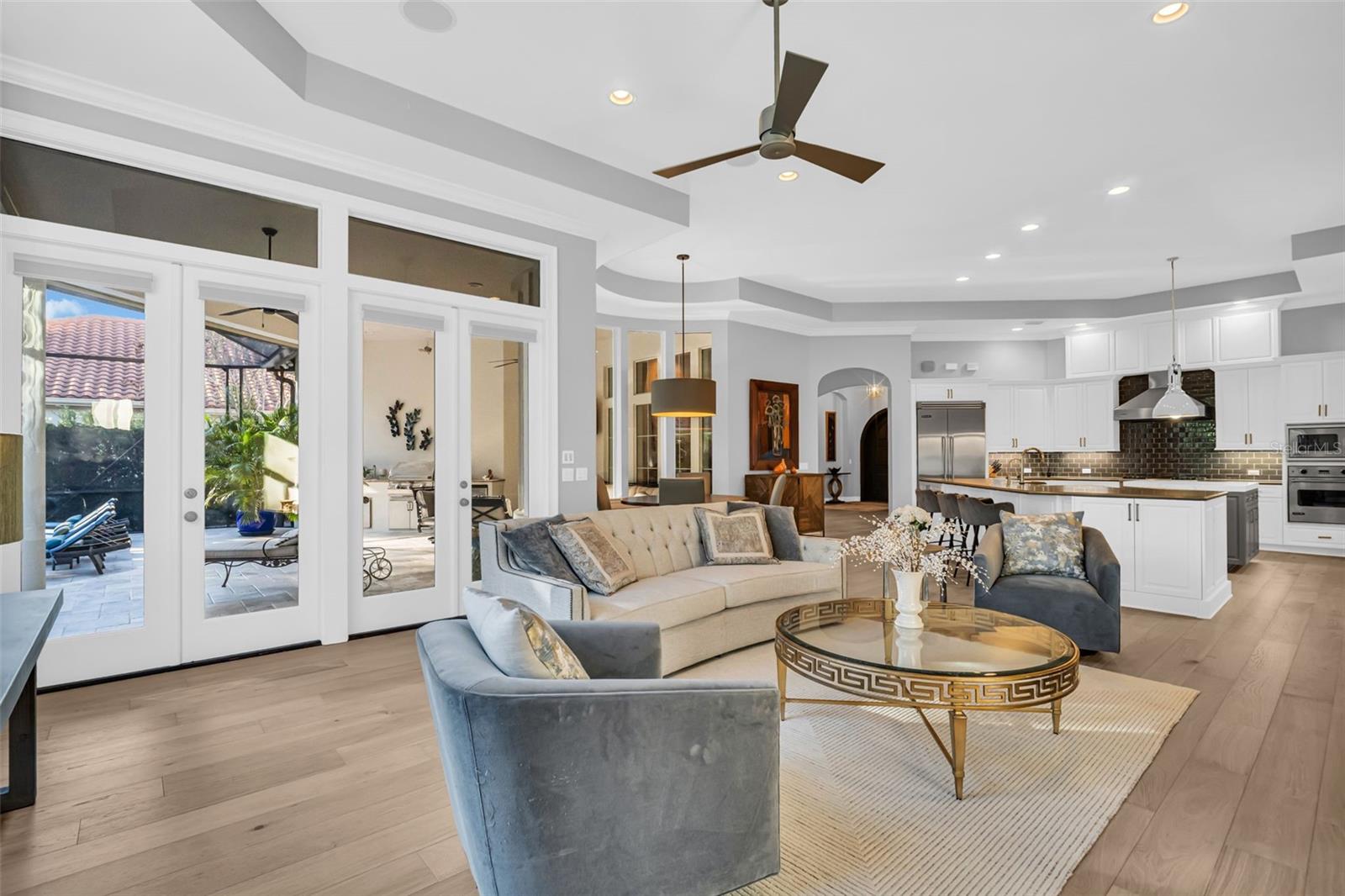 Family room with view of patio and pool area.