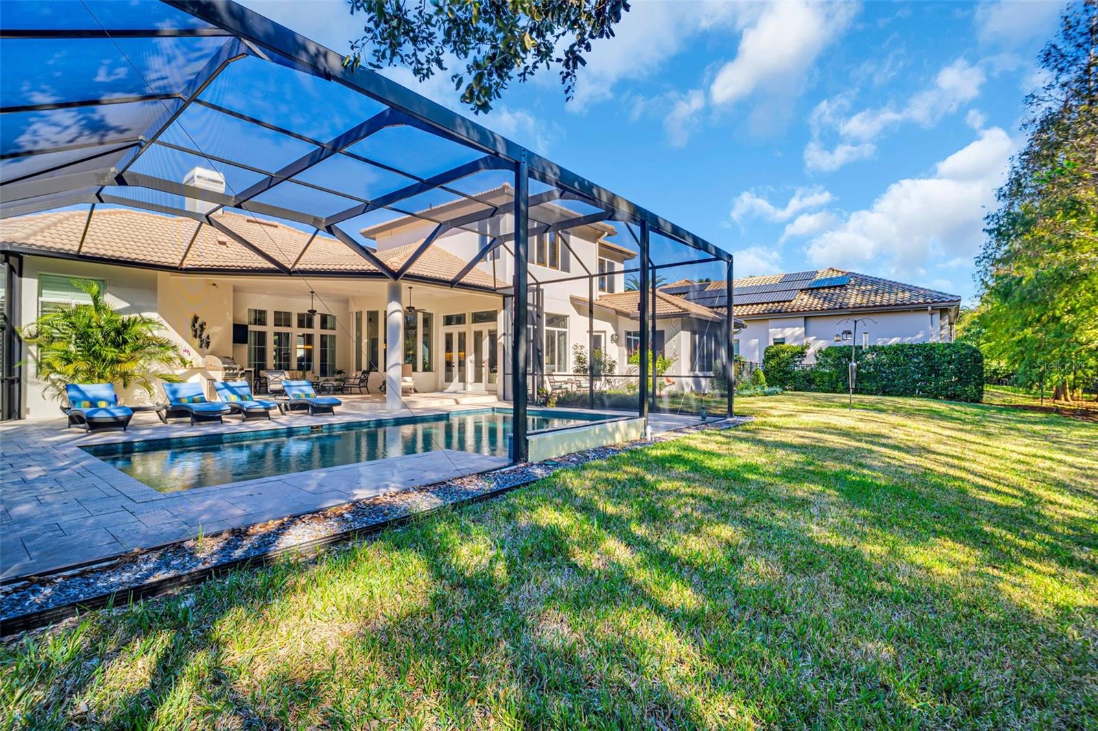 Rear of house and screened in pool area