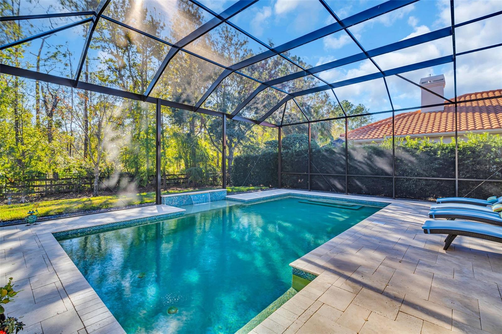 Screen enclosure with large panoramic panels for an unobstructed view of Booker Creek Preserve.