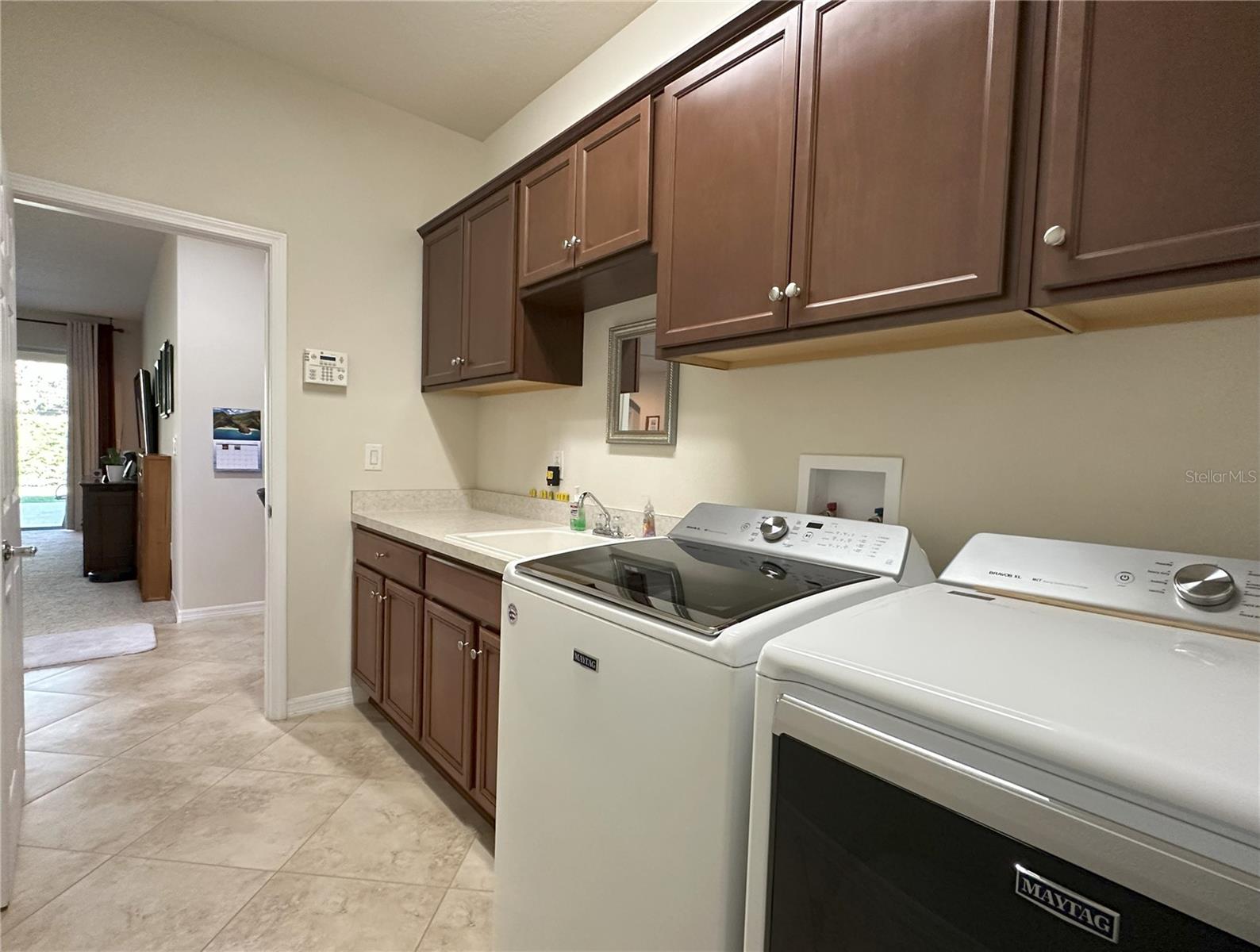 Laundry room with u/l cabinets and tub