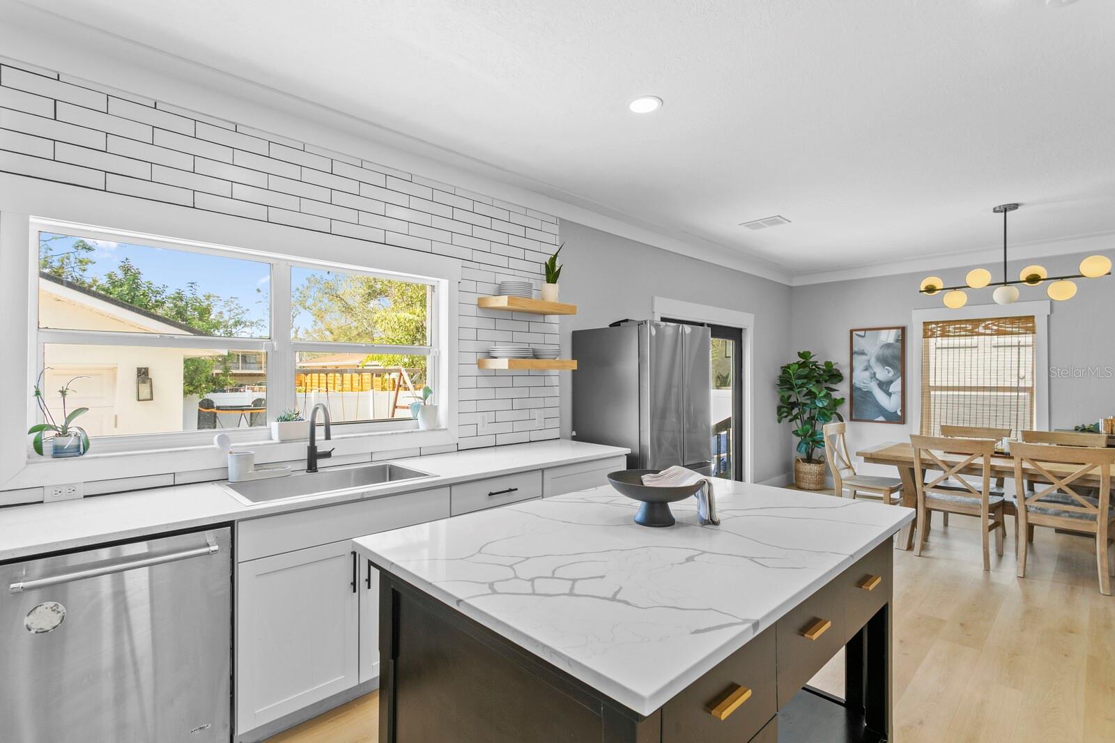 Beautiful stone counters in the kitchen and on the custom island