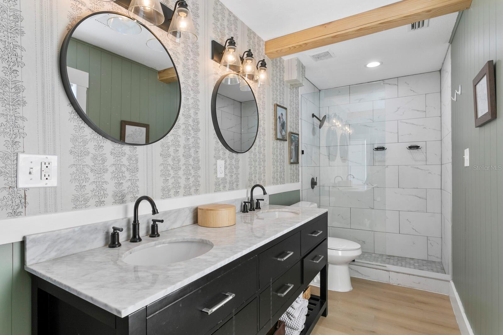 You'll find granite counters, dual vanities and decorative mirrors in the primary bath