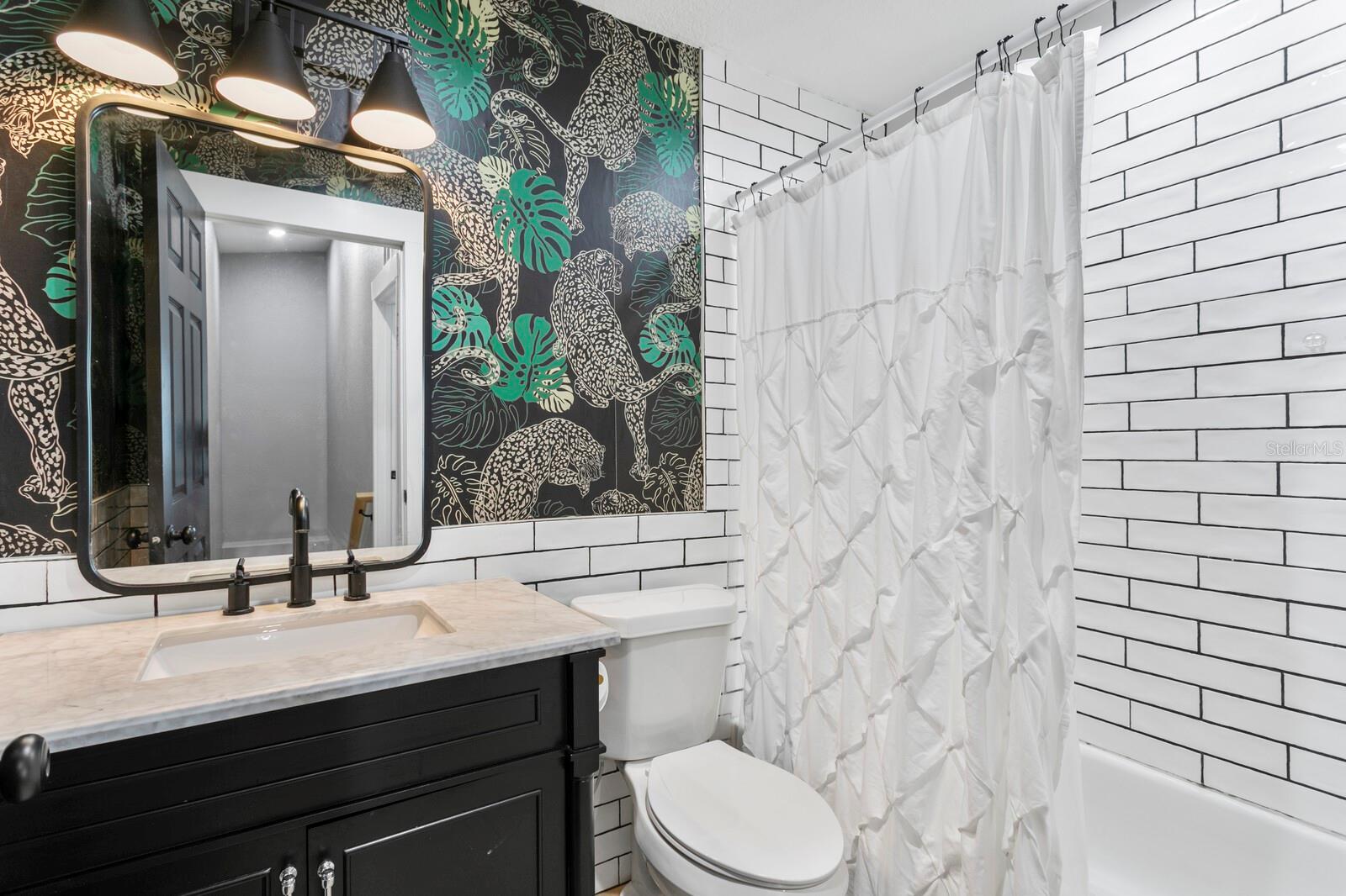 The 2nd full bath includes a tub/shower combo and granite counters