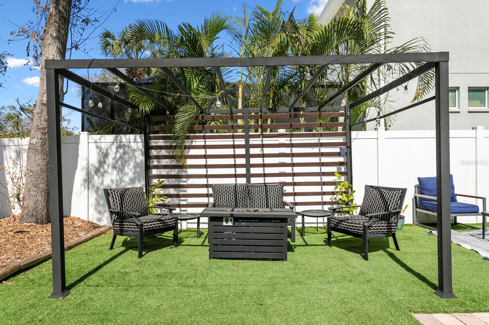 The custom pergola provides for additional outdoor living space