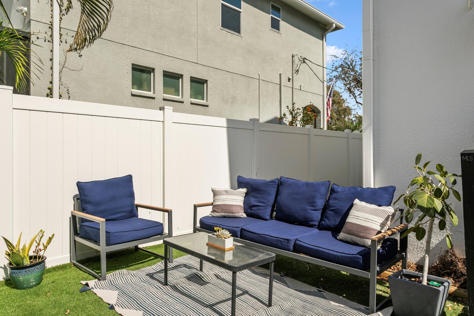 A separate outdoor living area provides even more entertaining space