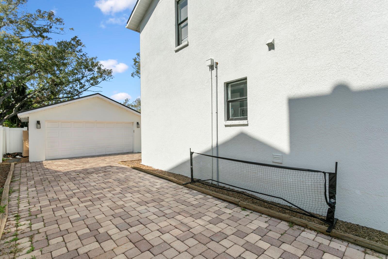 There's plenty of parking spaces with the paver driveway