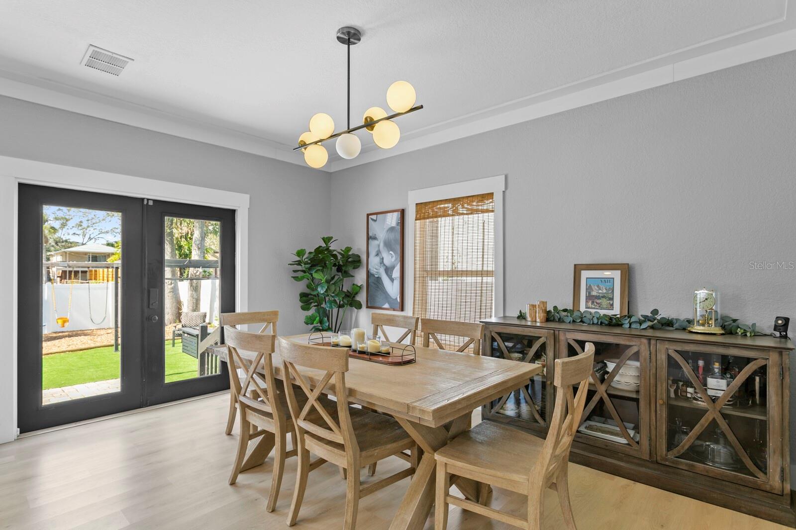 Just past the foyer is the dining room with French doors leading to the backyard