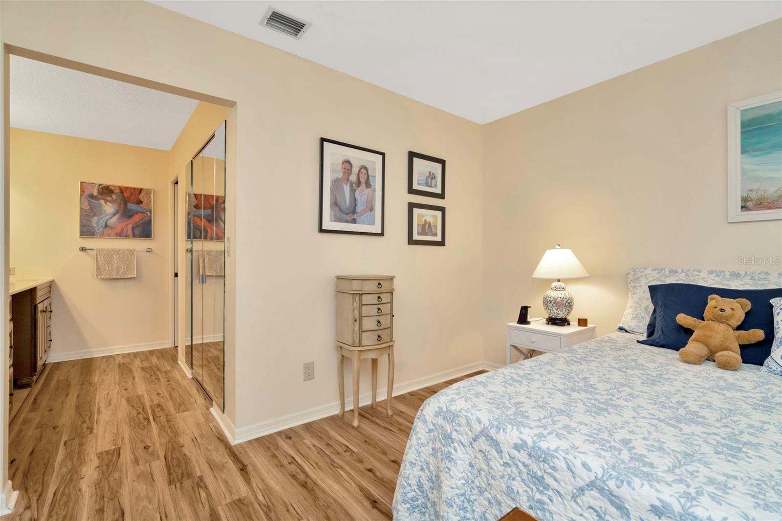 Primary bedroom with en-suite bath featuring dual vanities.