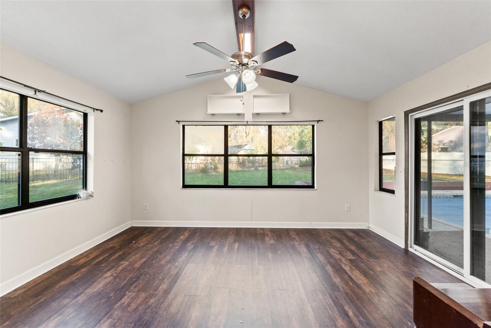 Dining room with a sliding door off of the pool.