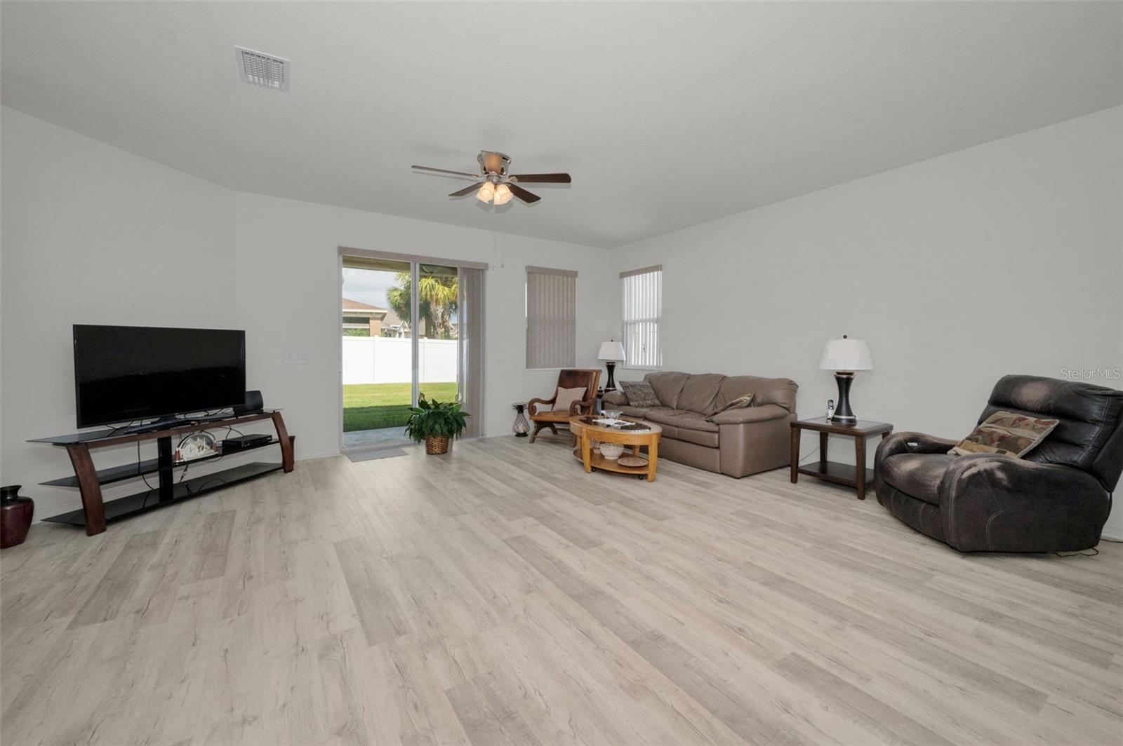 Great Room - sliders to covered lanai and fenced in backyard