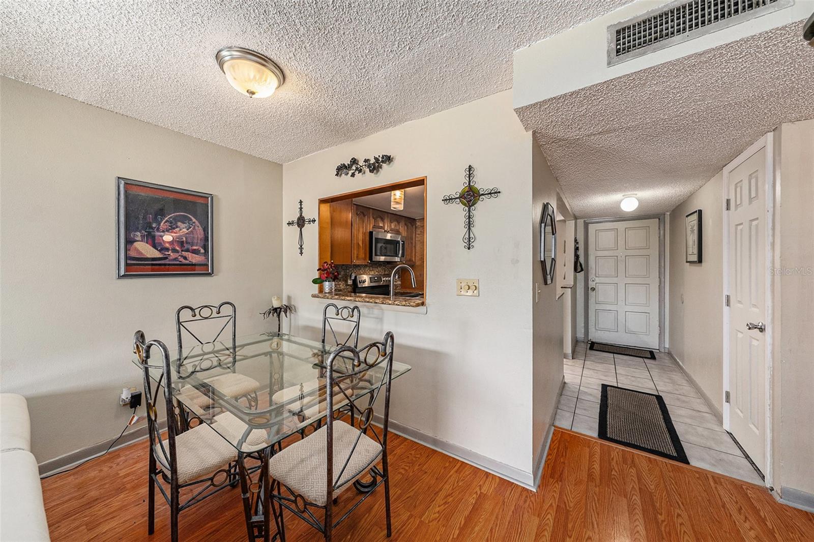 Convenient pass through window from kitchen to dining room.