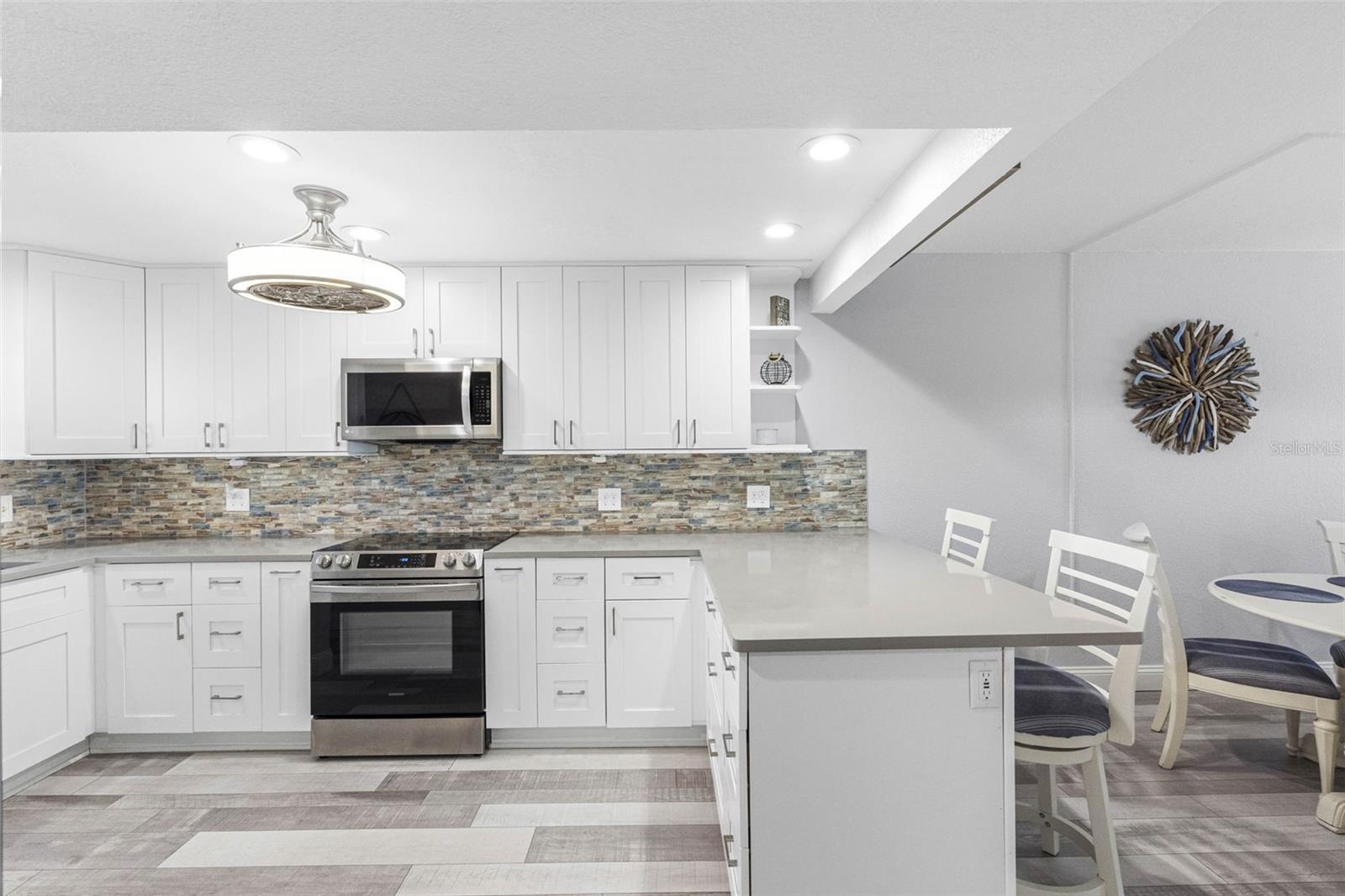 Spacious Kitchen with lots of wood cabinets and counter space