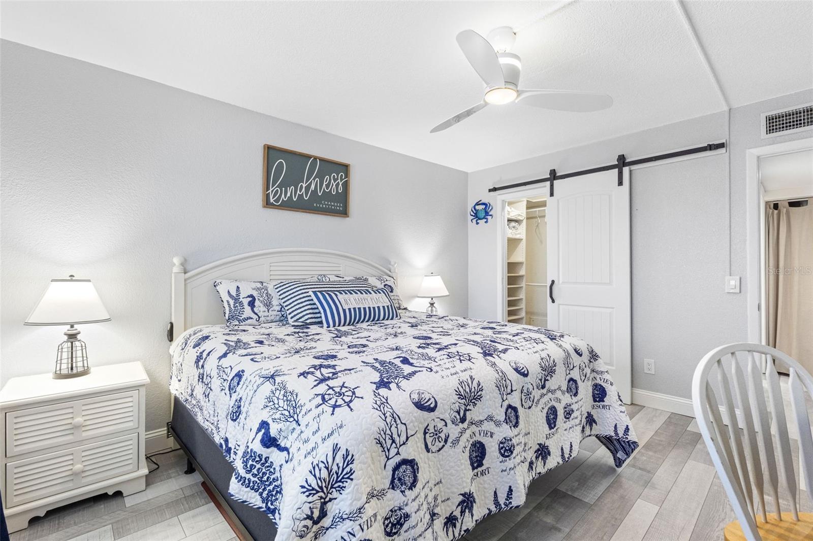 Primary Bedroom with Barn Door to the Walk In Closet