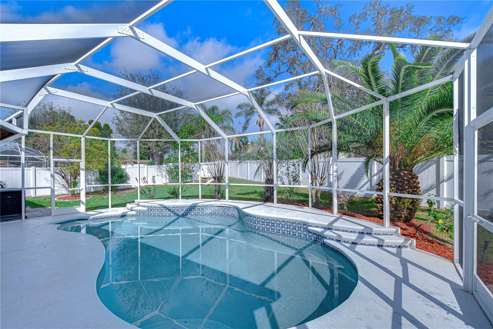 Relaxing pool oasis with screened lanai!