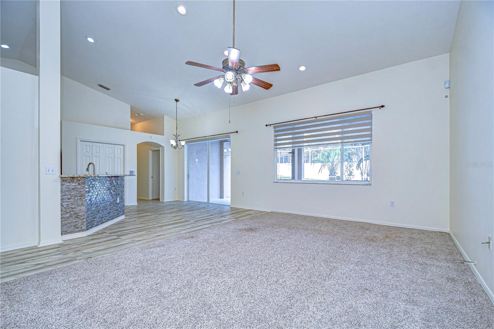 Spacious living area with modern updates and ample natural light, ideal for family gatherings.