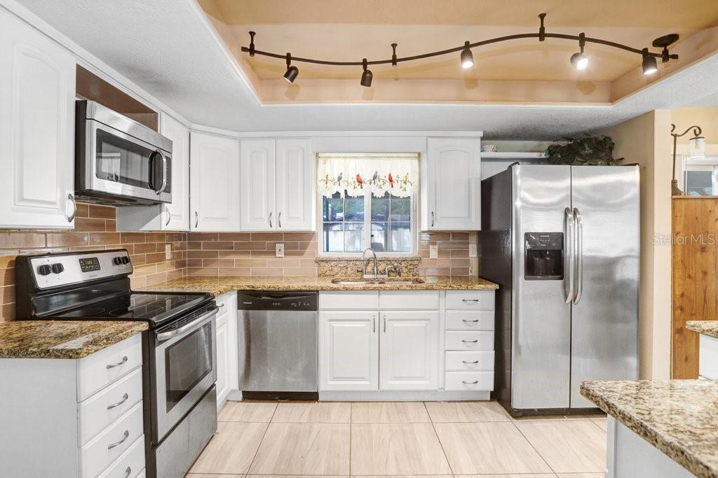 Beautiful Kitchen with granite countertops and SS appliances