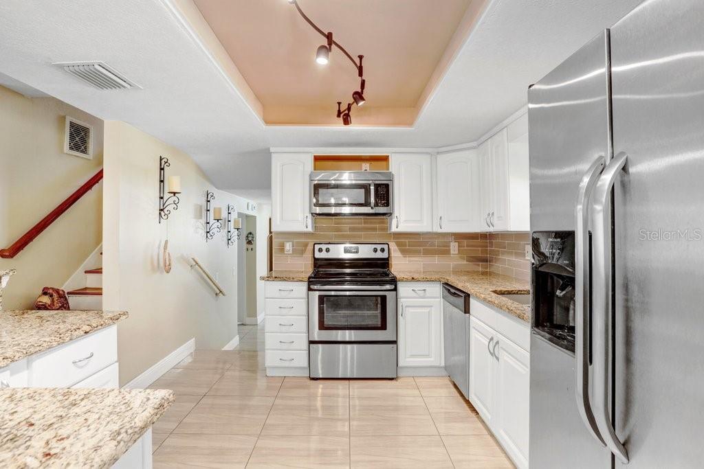 Beautiful Kitchen with granite countertops and SS appliances