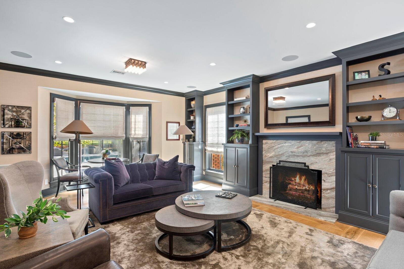 Gas fireplace, built-ins and view of the course.