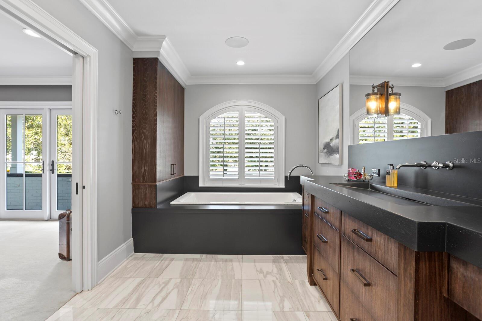 Marble floors in primary bathroom.