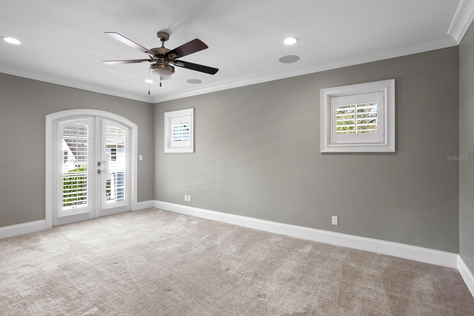 Guest room upstairs with walk in closet and en suite bathroom.