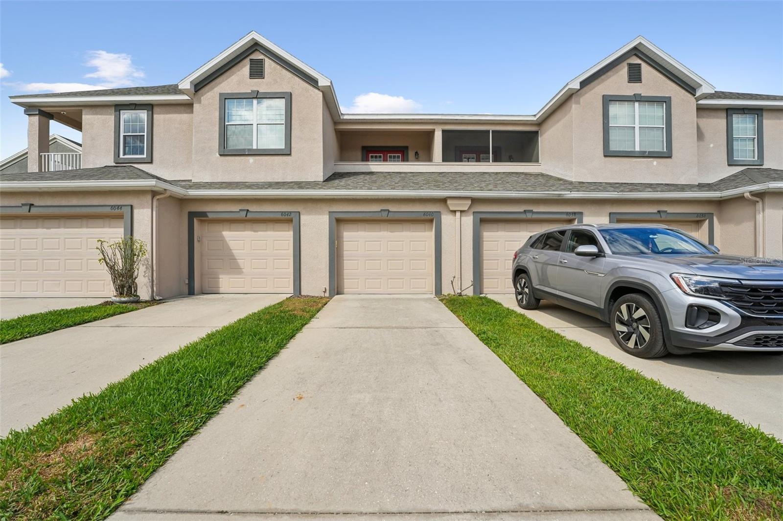 PRIVATE DRIVEWAY AND TANDEM 2 CAR GARAGE