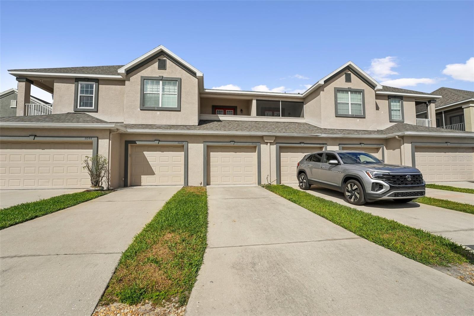 PRIVATE DRIVEWAY AND TANDEM 2 CAR GARAGE