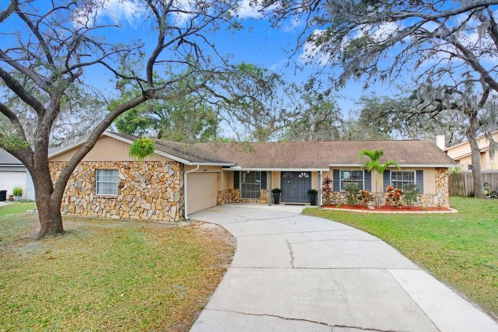 Front of home with view of side garage