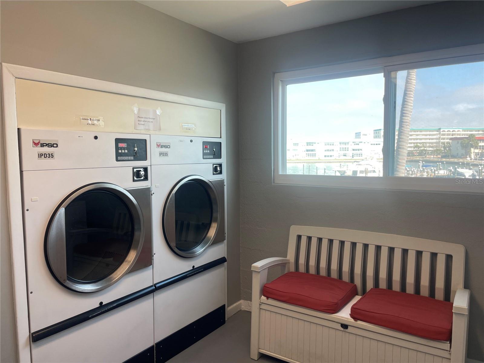 Immaculate laundry room with direct water view.