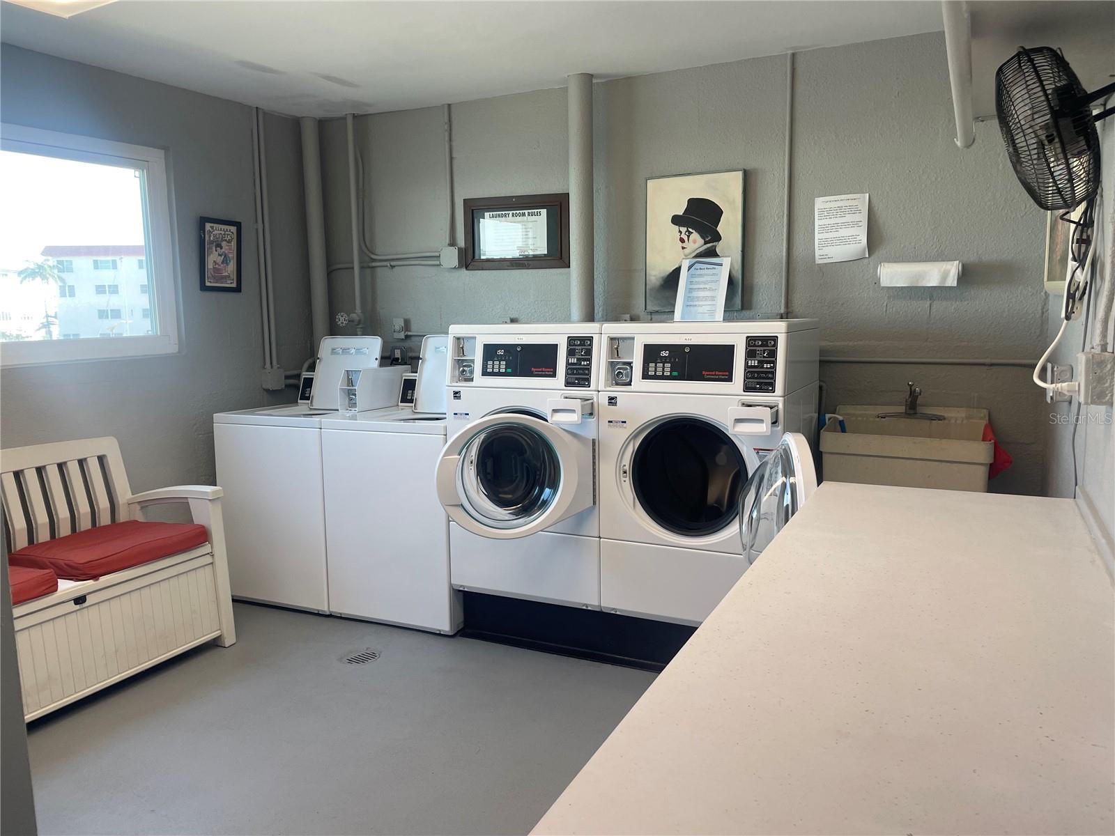 Spacious CLEAN laundry room with direct water view.