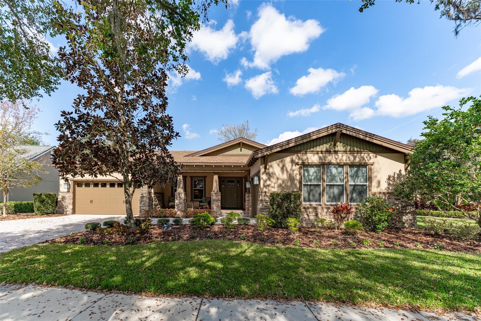 Beautiful Craftsman Elevation with Lush Landscaping & Paverd Driveway