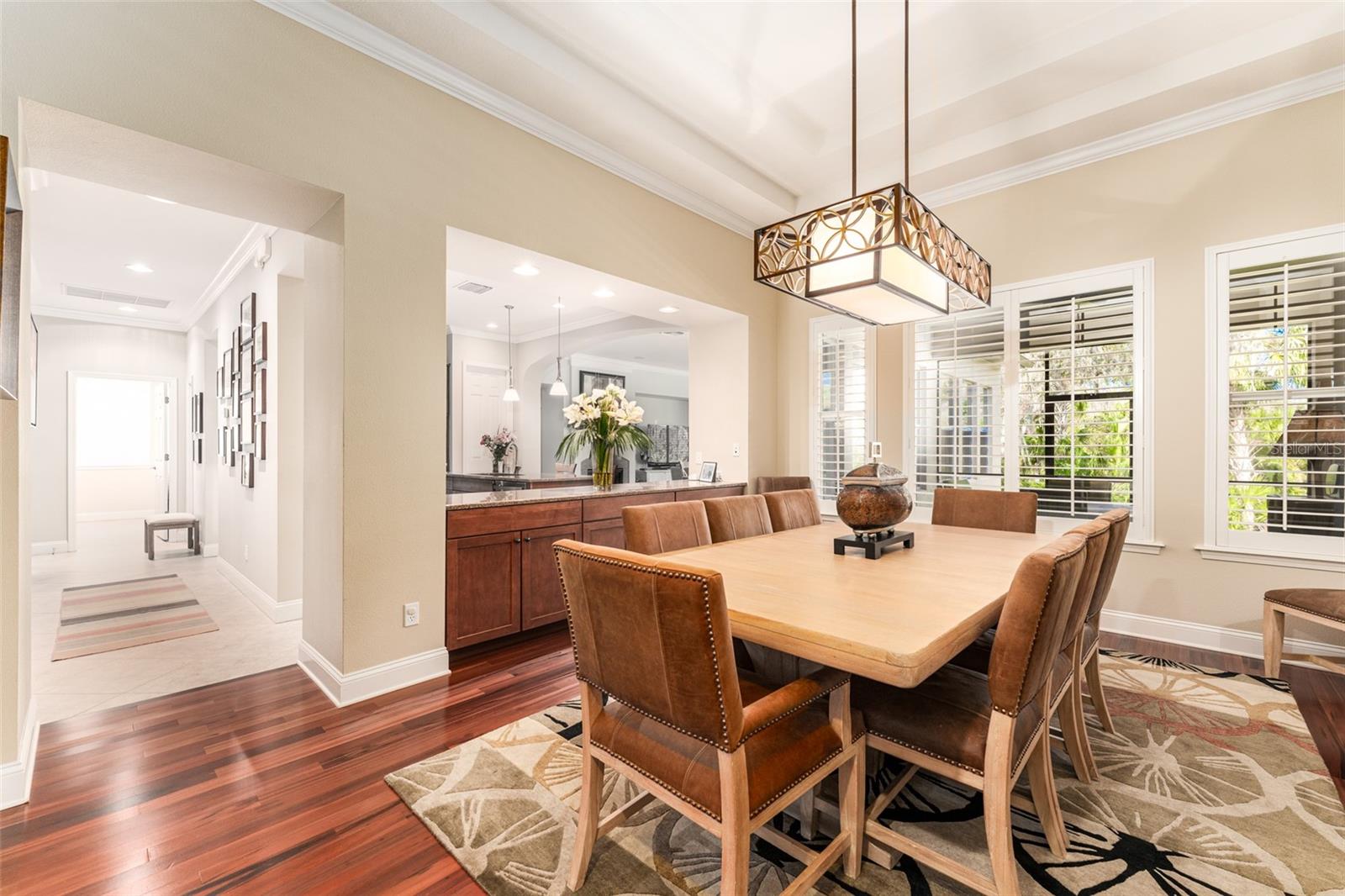 Spacious Dining Area with Pass Through Buffet & Built in Cabinetry