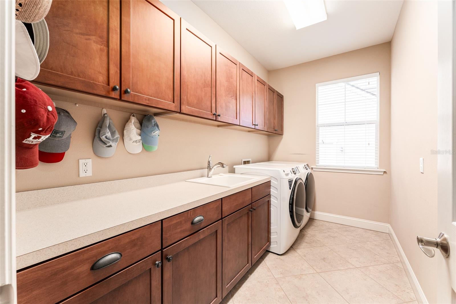 Laundry Room with Sink, Window For Natural Light, Built in Cabinets & Counter Space