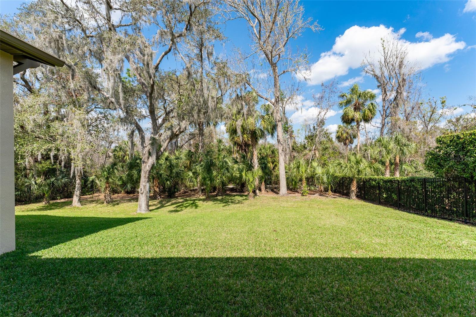 The backyard is spacious, private & fully fenced