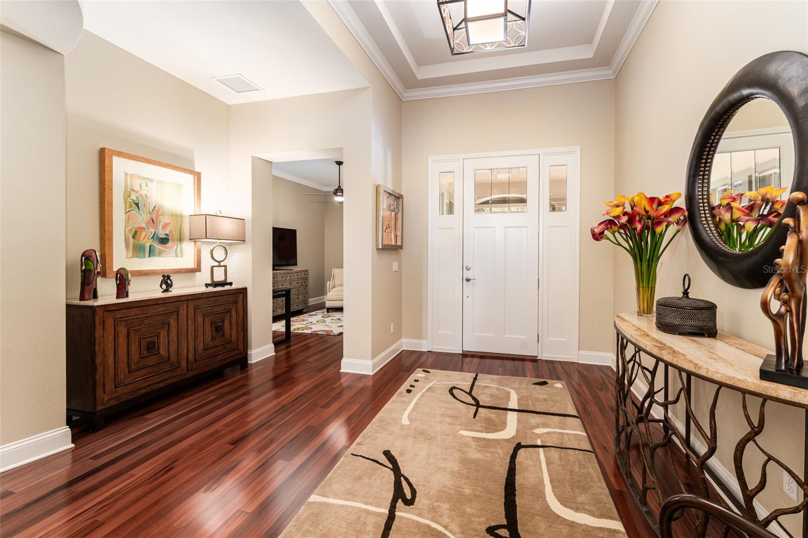 Grand Foyer with Rich Hardwood Flooring