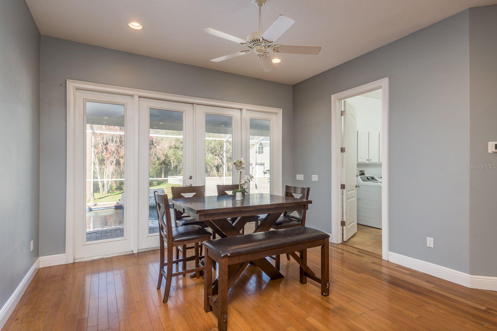 Casual dining area with lovely views over the pool and extensive wooded grounds.