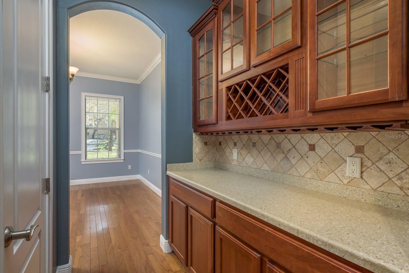 Butlers pantry conveniently connects kitchen to formal dining room.