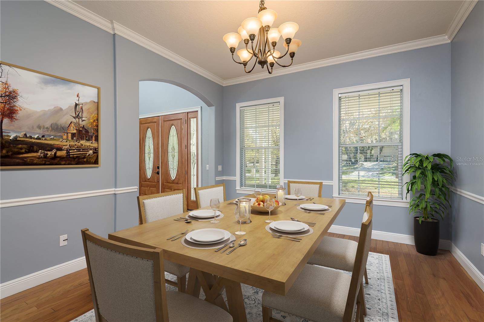 Virtually staged. Gorgeous formal dining room.