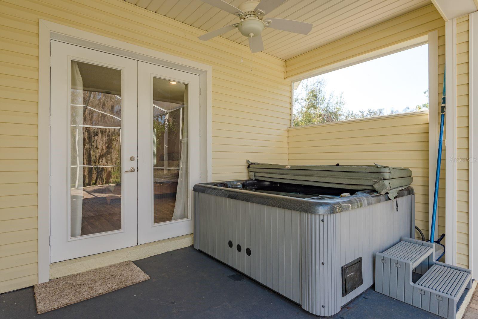 Relaxing hot tub just outside the primary bedroom French doors.