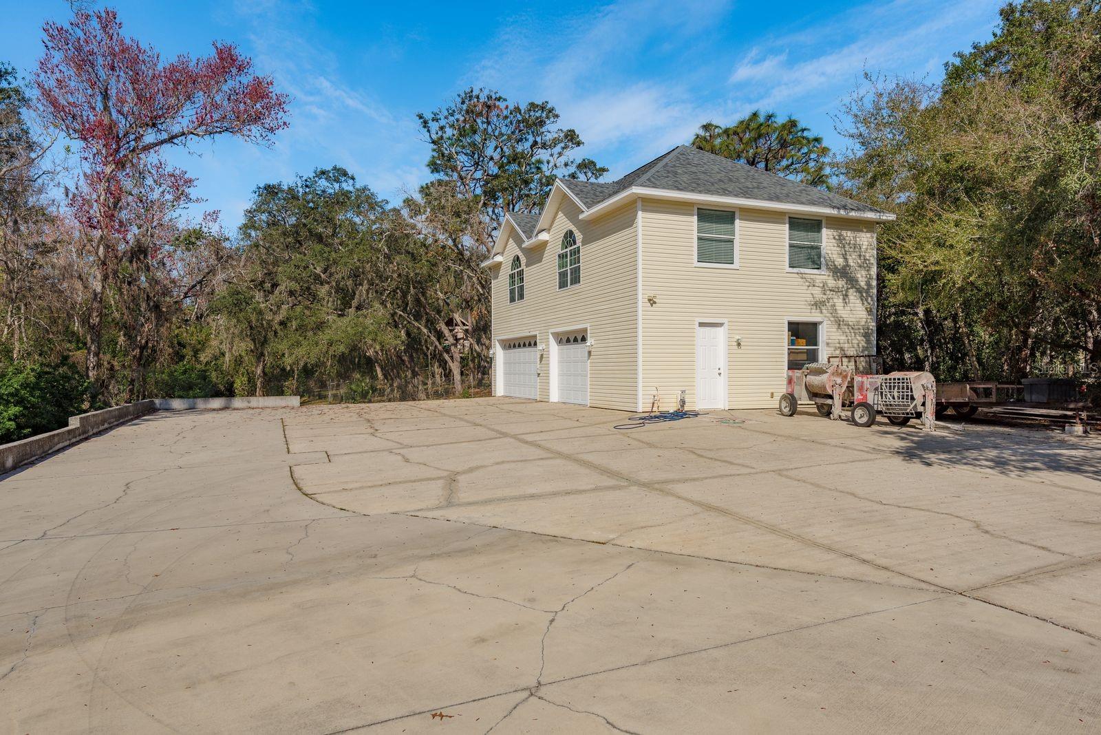 4 car garage with room for all your toys and an apartment above.