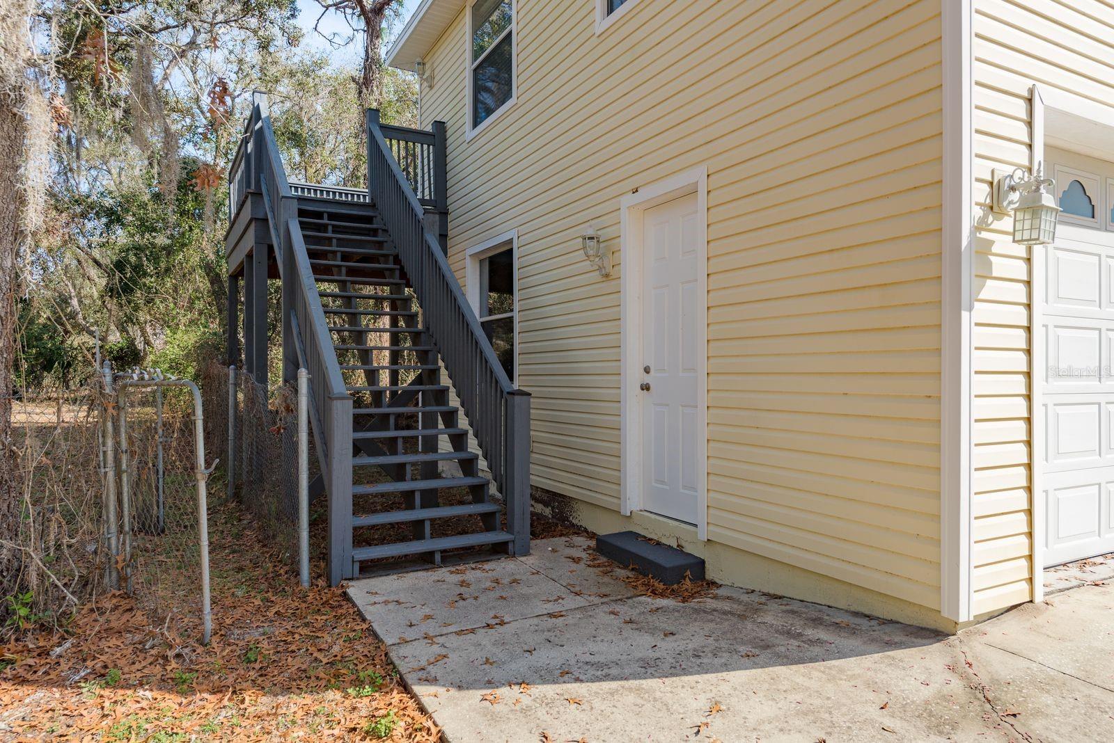 Steps up to apartment (there are also steps up from inside the garage)