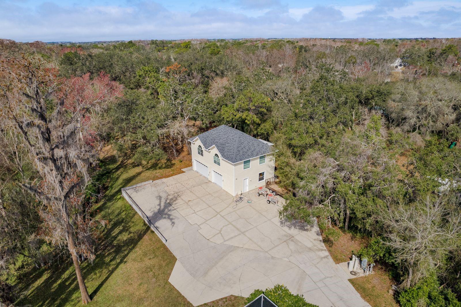 Aerial view of detached 4 car garage and apartment.