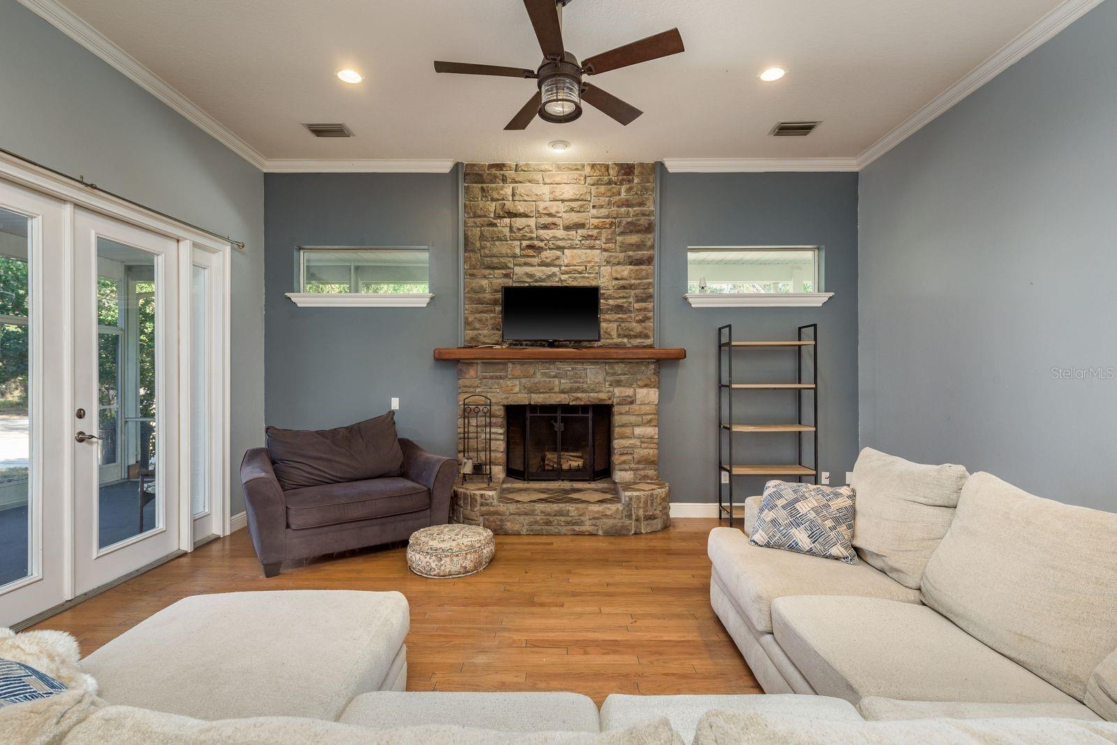 Comfy family room with wood burning fireplace.